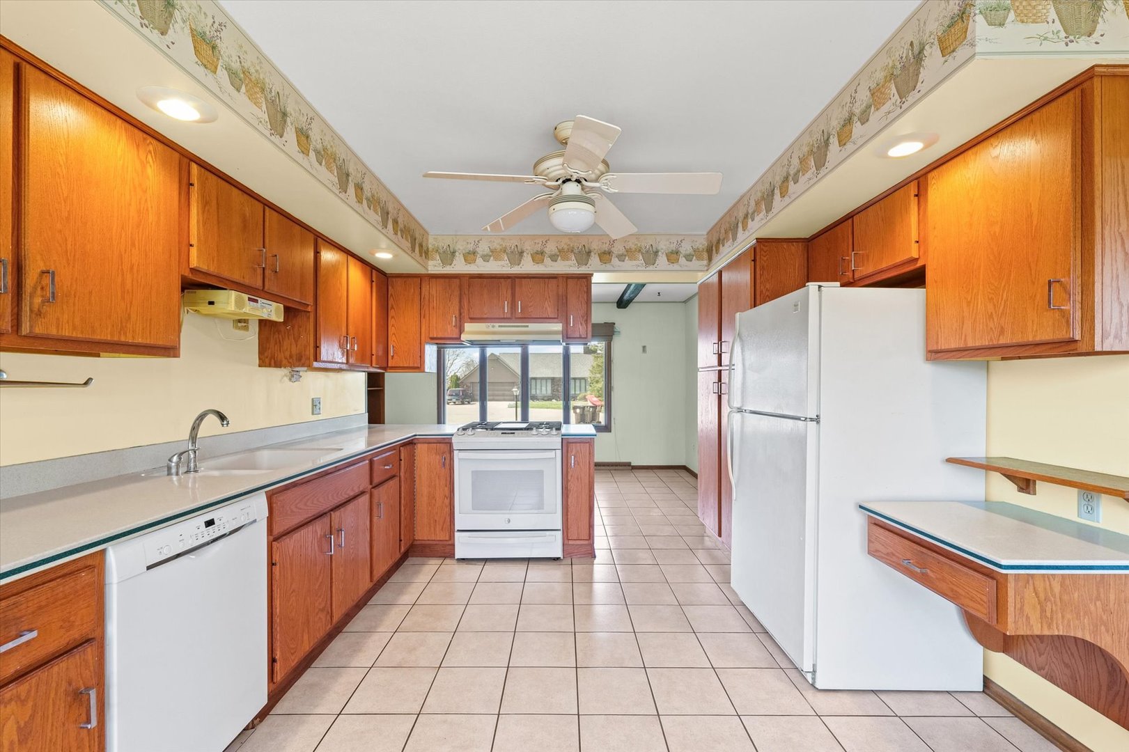 510 Parker Place Rantoul, IL 61866 - Photo 12 of 33 a kitchen with stainless steel appliances granite countertop a refrigerator and a sink