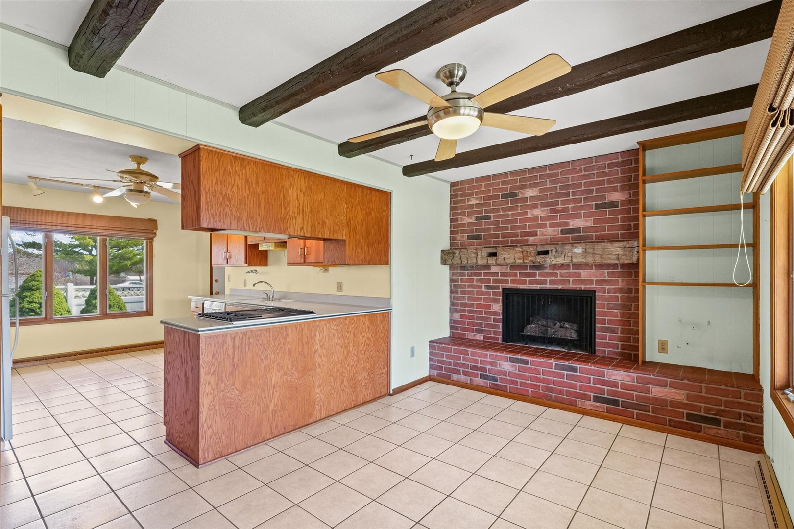 510 Parker Place Rantoul, IL 61866 - Photo 14 of 33 a kitchen with stainless steel appliances granite countertop a stove a sink and a fireplace