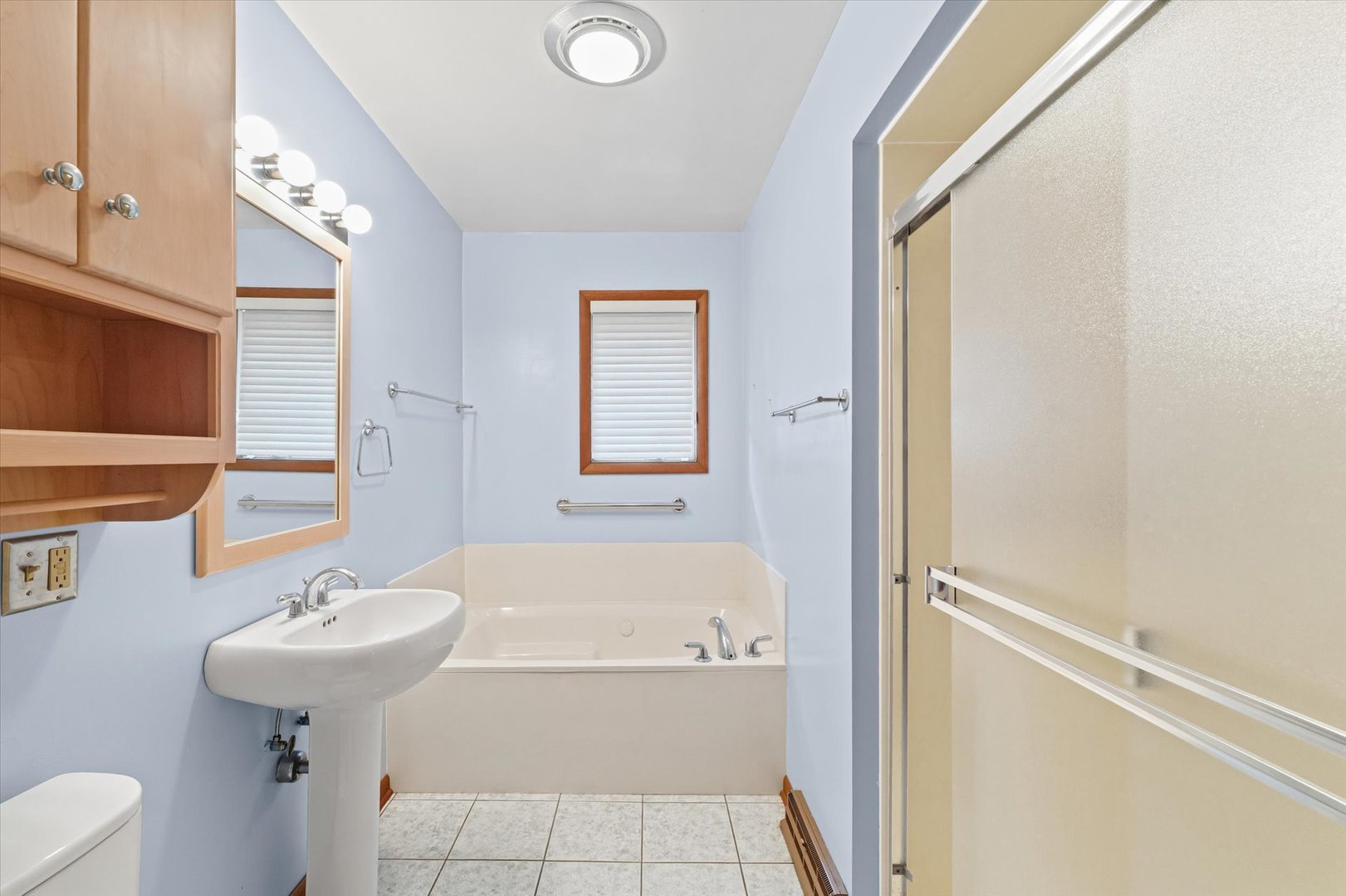 510 Parker Place Rantoul, IL 61866 - Photo 17 of 33 a bathroom with a sink a toilet and shower