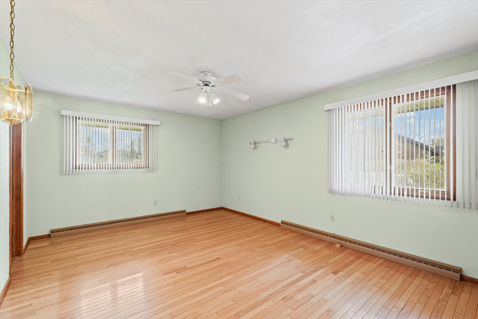 510 Parker Place Rantoul, IL 61866 - Photo 18 of 33 a view of an empty room with wooden floor and a window