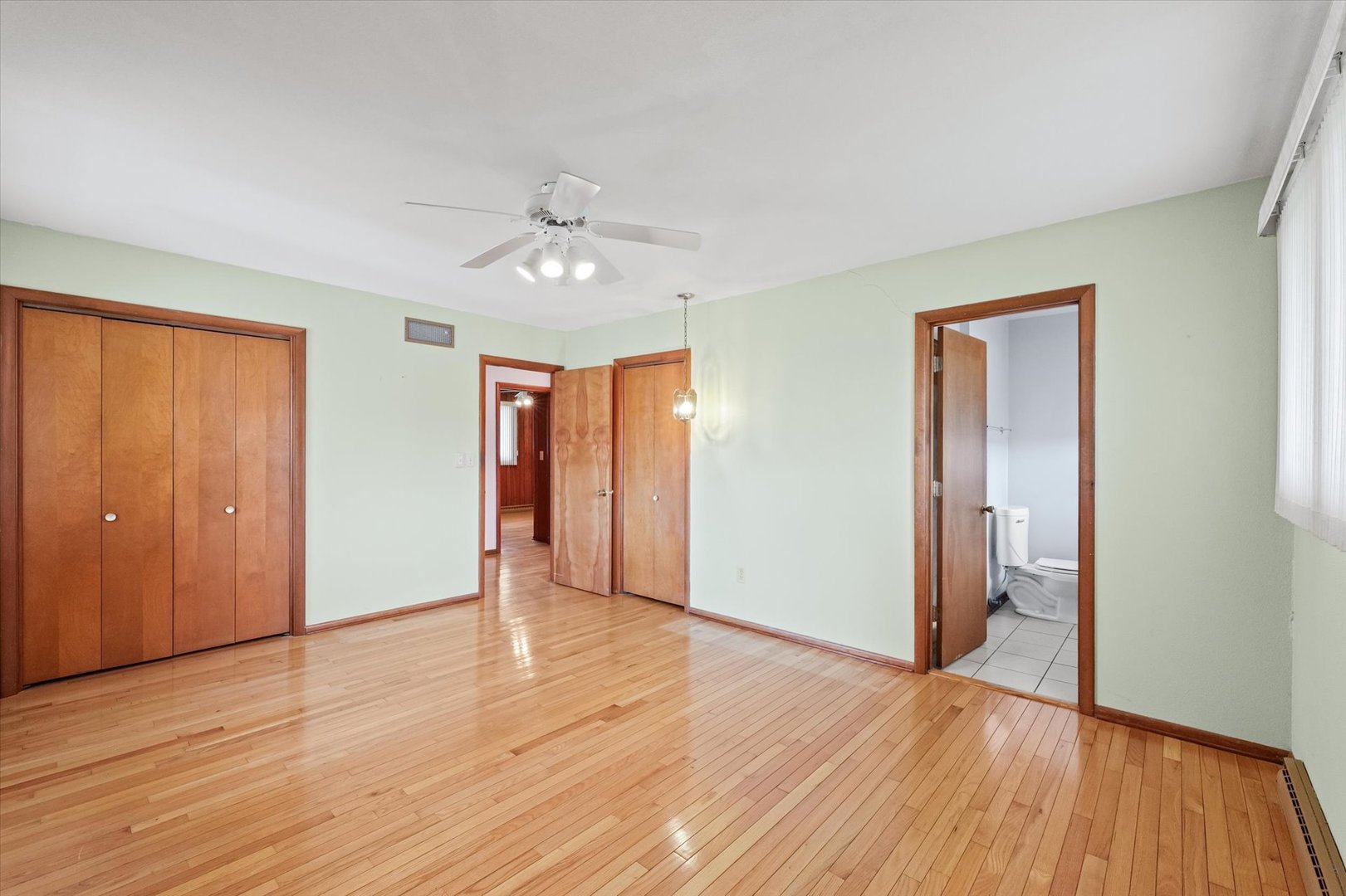 510 Parker Place Rantoul, IL 61866 - Photo 19 of 33 a view of an empty room with wooden floor
