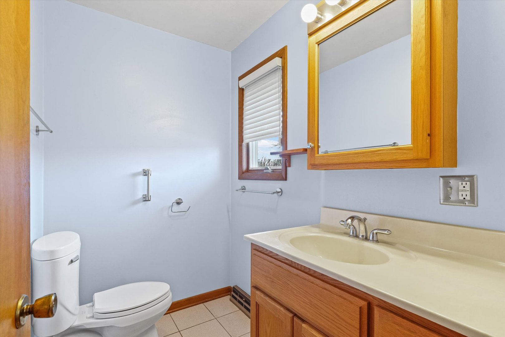 510 Parker Place Rantoul, IL 61866 - Photo 20 of 33 a bathroom with a granite countertop sink mirror and a toilet
