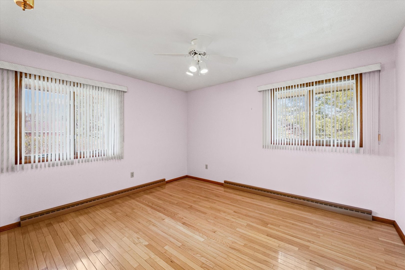 510 Parker Place Rantoul, IL 61866 - Photo 21 of 33 a view of an empty room with wooden floor and a window