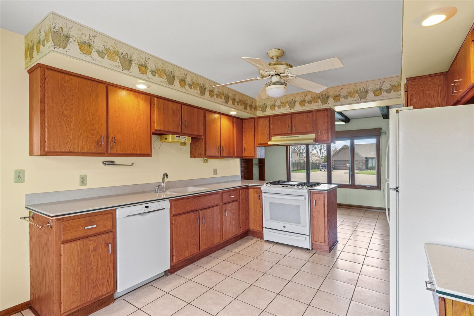 510 Parker Place Rantoul, IL 61866 - Photo 9 of 33 a kitchen with stainless steel appliances granite countertop a sink and cabinets