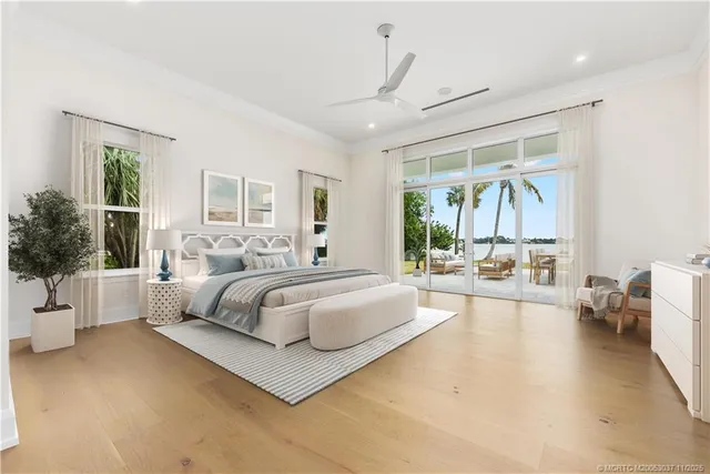 a spacious bedroom with a large bed and a couch