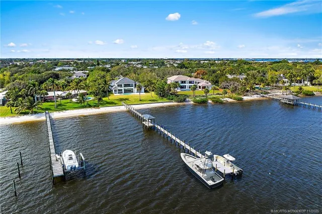 an aerial view of a house with a ocean view