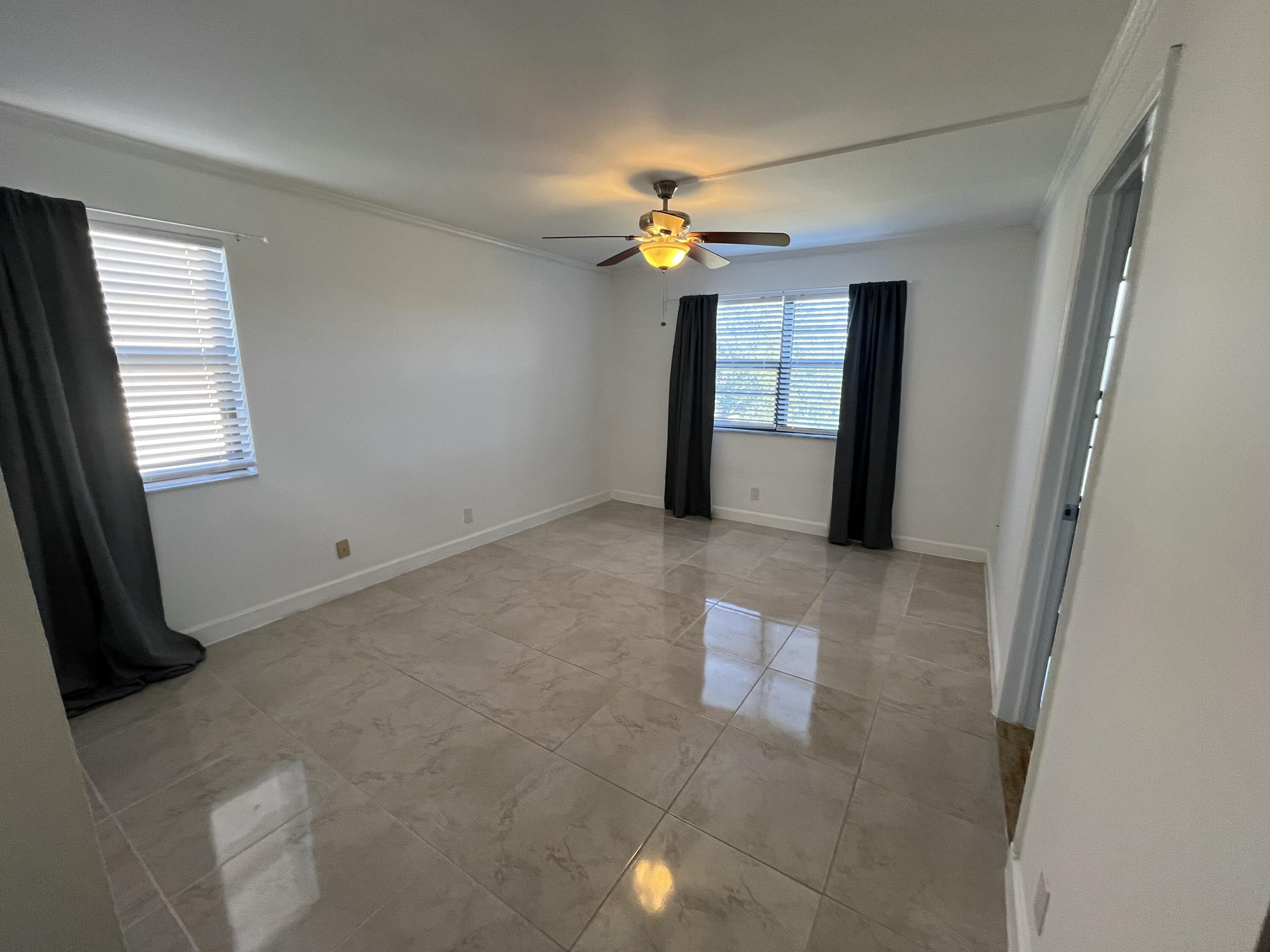 9300 Southwest 8th Street, Unit 301 Boca Raton, FL 33428 - Photo 13 of 27 a view of empty room with window