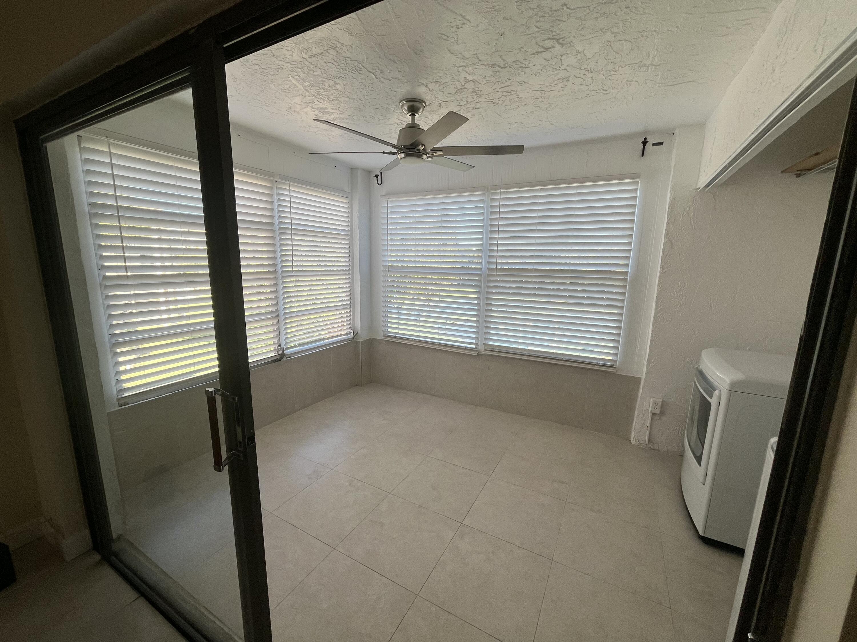 9300 Southwest 8th Street, Unit 301 Boca Raton, FL 33428 - Photo 19 of 27 a view of an empty room with a window
