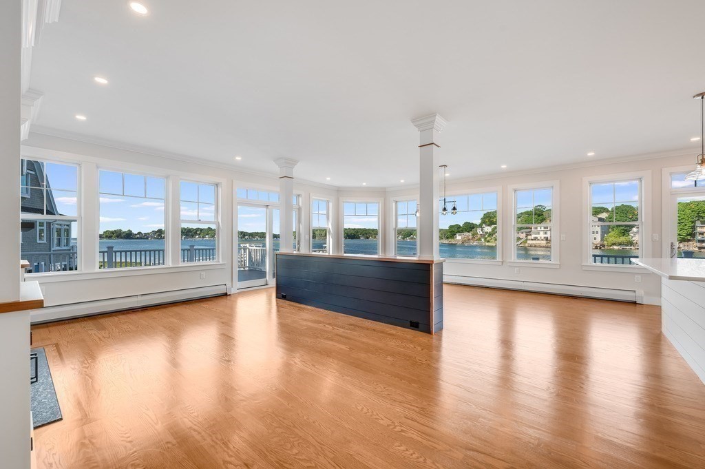 8 Riverside Road Gloucester, MA 01930 - Photo 11 of 40 a view of a living room and kitchen with a large window