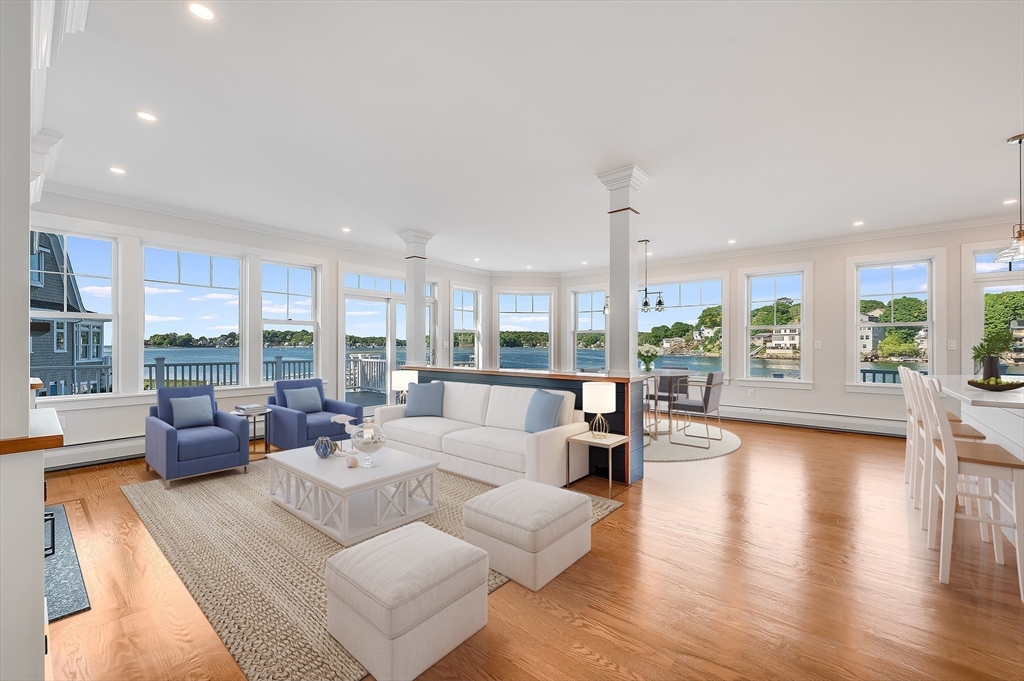 8 Riverside Road Gloucester, MA 01930 - Photo 12 of 40 a living room with furniture large windows and wooden floor