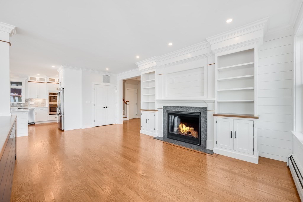 8 Riverside Road Gloucester, MA 01930 - Photo 13 of 40 a view of an empty room with a fireplace