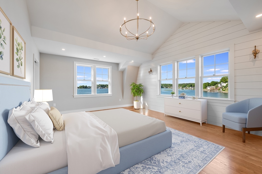 8 Riverside Road Gloucester, MA 01930 - Photo 19 of 40 a spacious bedroom with a bed and a large window