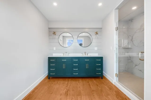 a bathroom with a sink and a large mirror