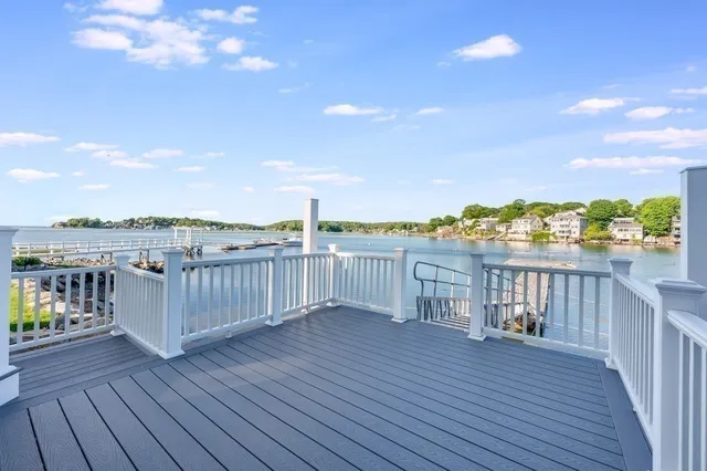 a view of a balcony with wooden floor