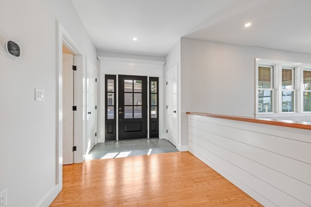 8 Riverside Road Gloucester, MA 01930 - Photo 4 of 40 a view of an empty room with window and wooden floor