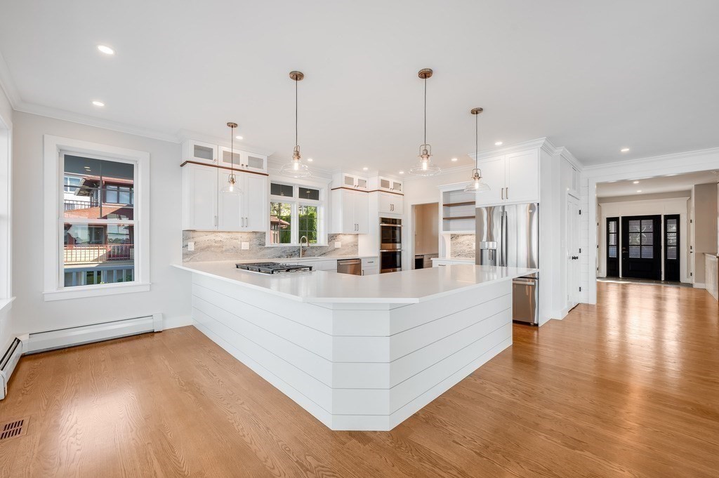 8 Riverside Road Gloucester, MA 01930 - Photo 8 of 40 a large white kitchen with kitchen island