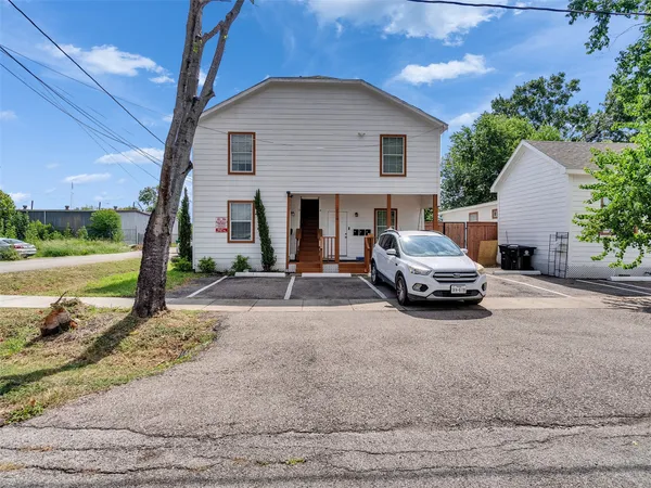 a view of a car parked in front of house