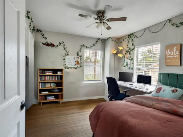 a bedroom with a bed furniture and a window