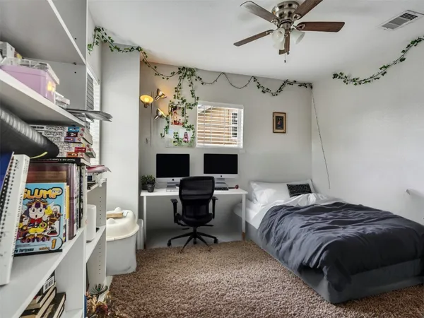 a bedroom with a bed and furniture