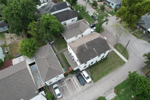an aerial view of residential house with outdoor space and parking
