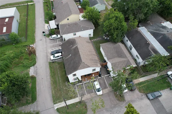 an aerial view of residential house with outdoor space and parking