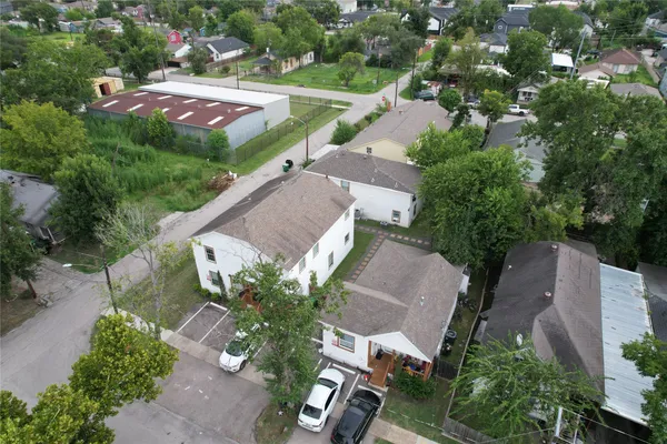 an aerial view of a house with outdoor space and street view