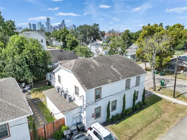 a aerial view of a house with a yard