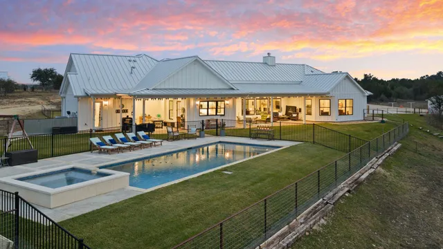 a view of a swimming pool with a patio