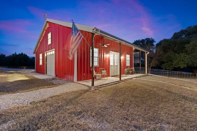 a view of backyard with yellow lighting