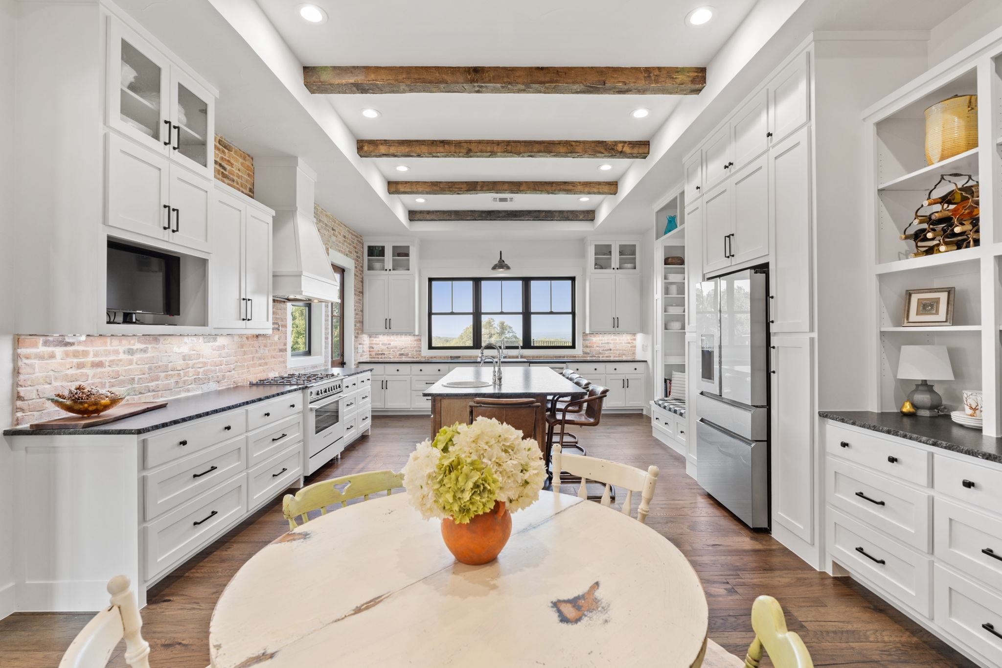 452 Southwick Ranch Road Johnson City, TX 78636 - Photo 8 of 30 a bathroom with double vanity sinks a large mirror and a shower