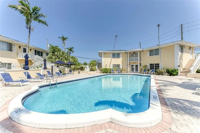 a view of a swimming pool with a lounge chair