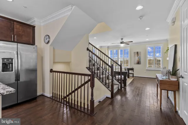 a view of entryway and hall with wooden floor