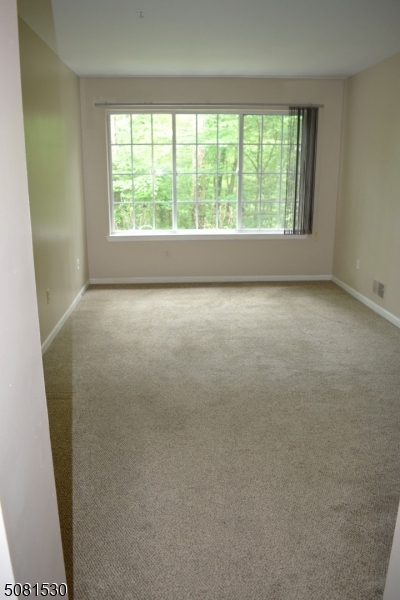 177 Riveredge Drive Chatham, NJ 07928 - Photo 15 of 17 an empty room with windows