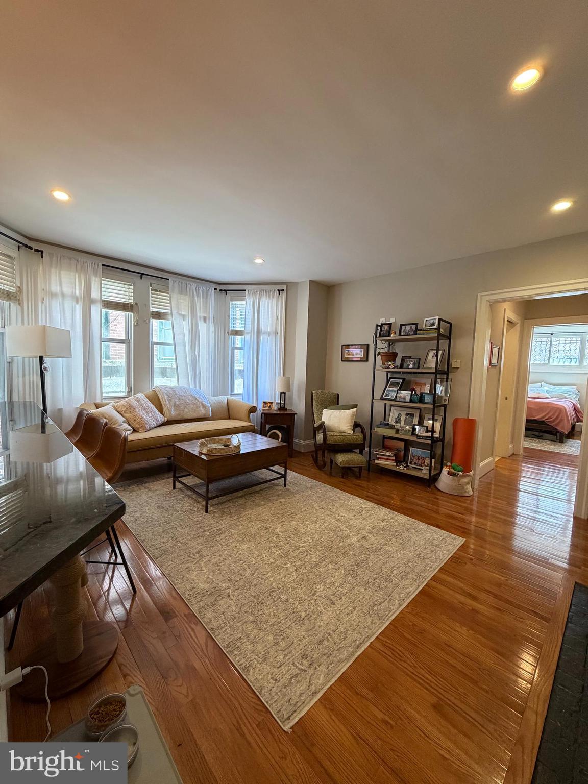 1820 Pine Street, Unit 1R Philadelphia, PA 19103 - Photo 1 of 17 a living room with furniture and a wooden floor