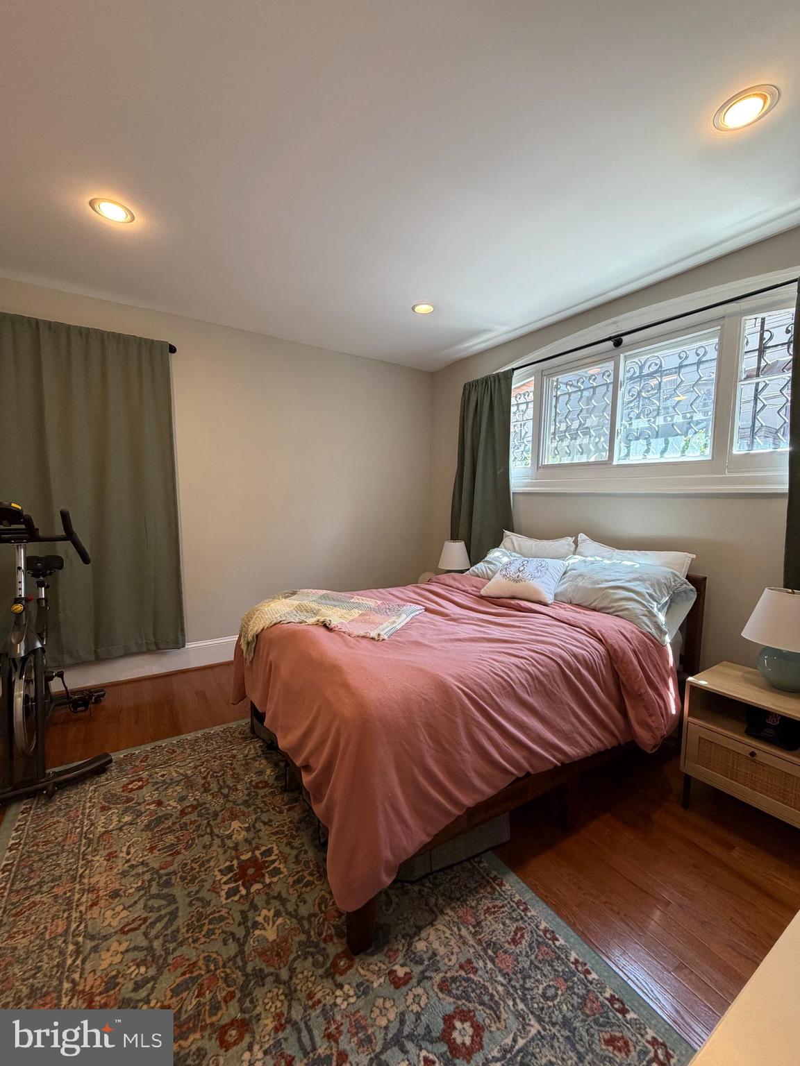 1820 Pine Street, Unit 1R Philadelphia, PA 19103 - Photo 11 of 17 a bedroom with a bed and a night stand