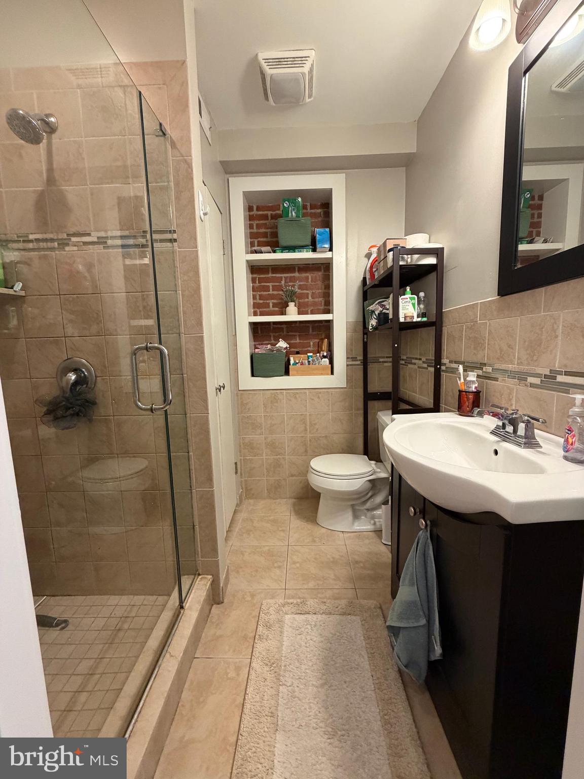 1820 Pine Street, Unit 1R Philadelphia, PA 19103 - Photo 14 of 17 a bathroom with a sink toilet and shower