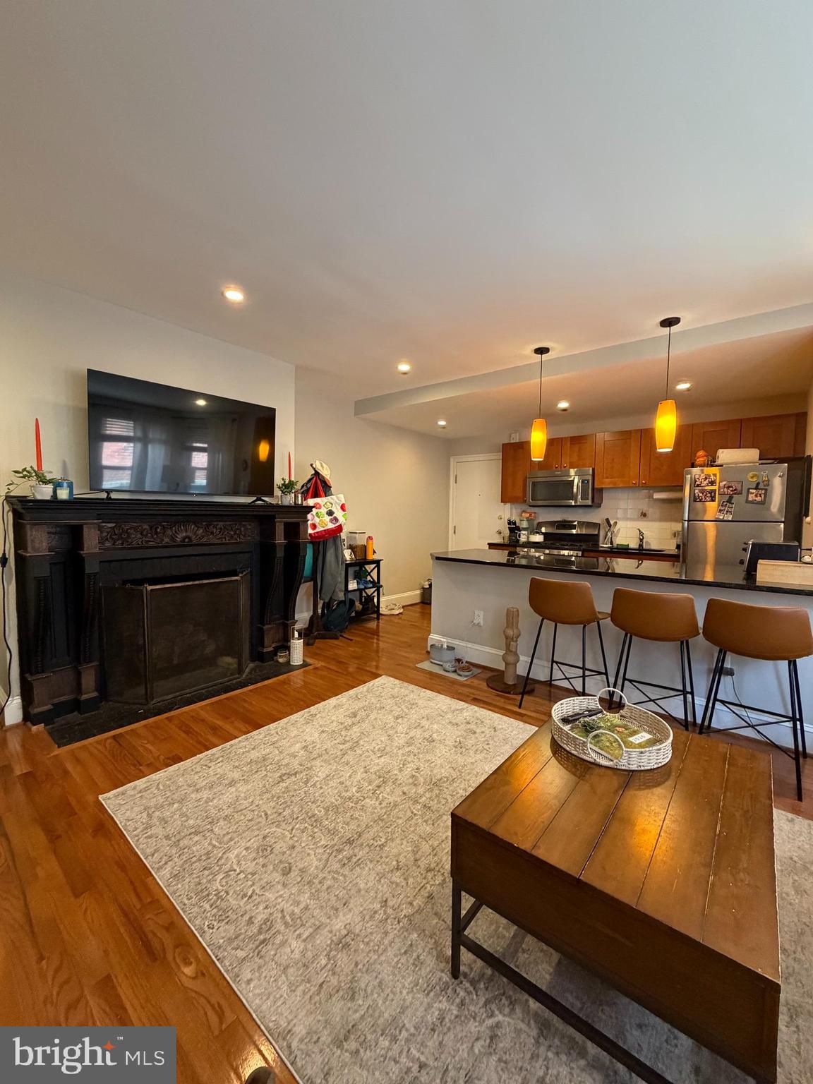 1820 Pine Street, Unit 1R Philadelphia, PA 19103 - Photo 5 of 17 a living room with furniture and a flat screen tv