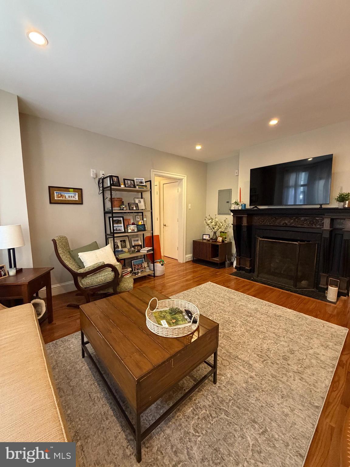 1820 Pine Street, Unit 1R Philadelphia, PA 19103 - Photo 6 of 17 a living room with furniture and a flat screen tv