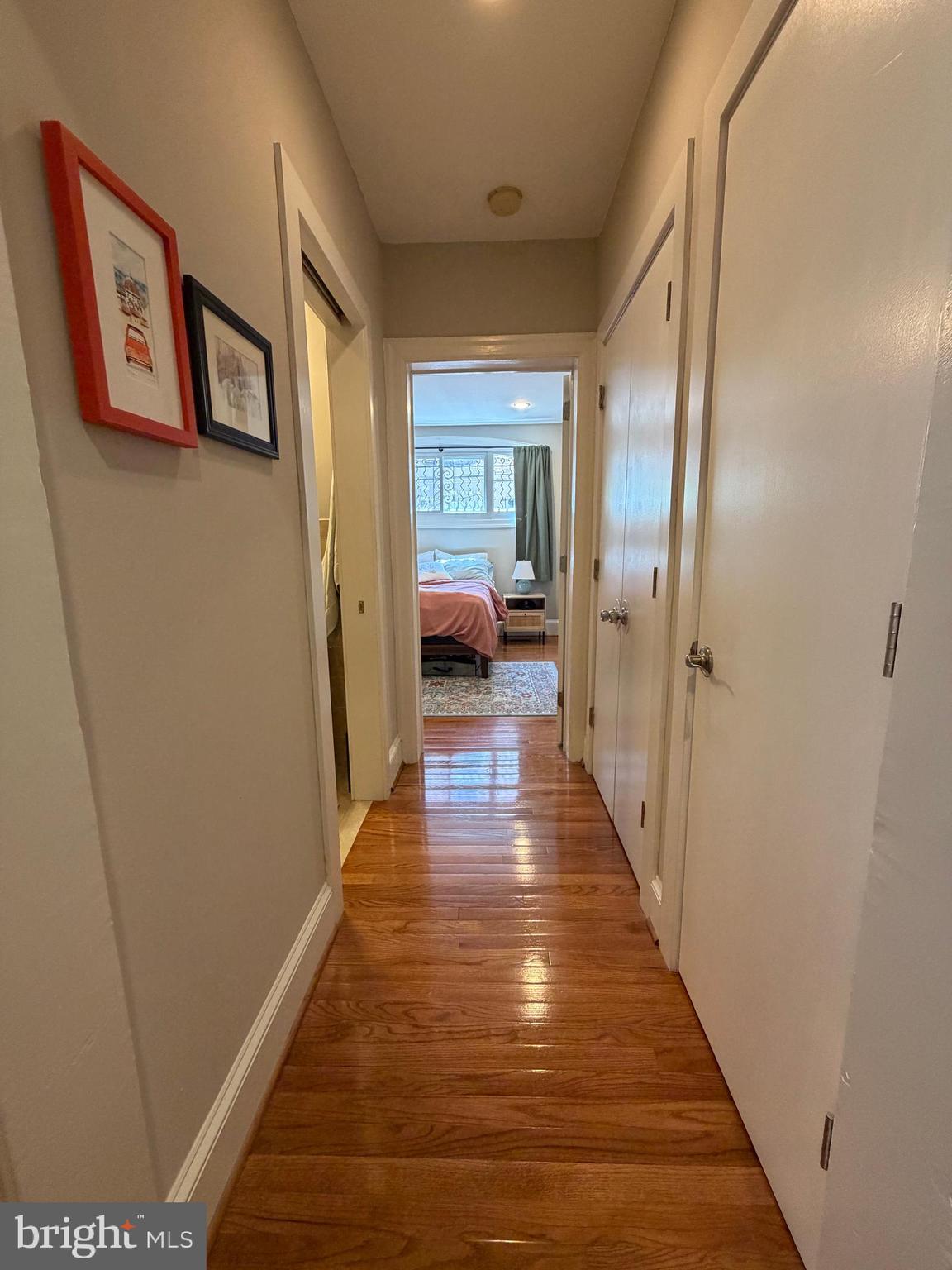 1820 Pine Street, Unit 1R Philadelphia, PA 19103 - Photo 8 of 17 a hallway with wooden floor closet and bathroom