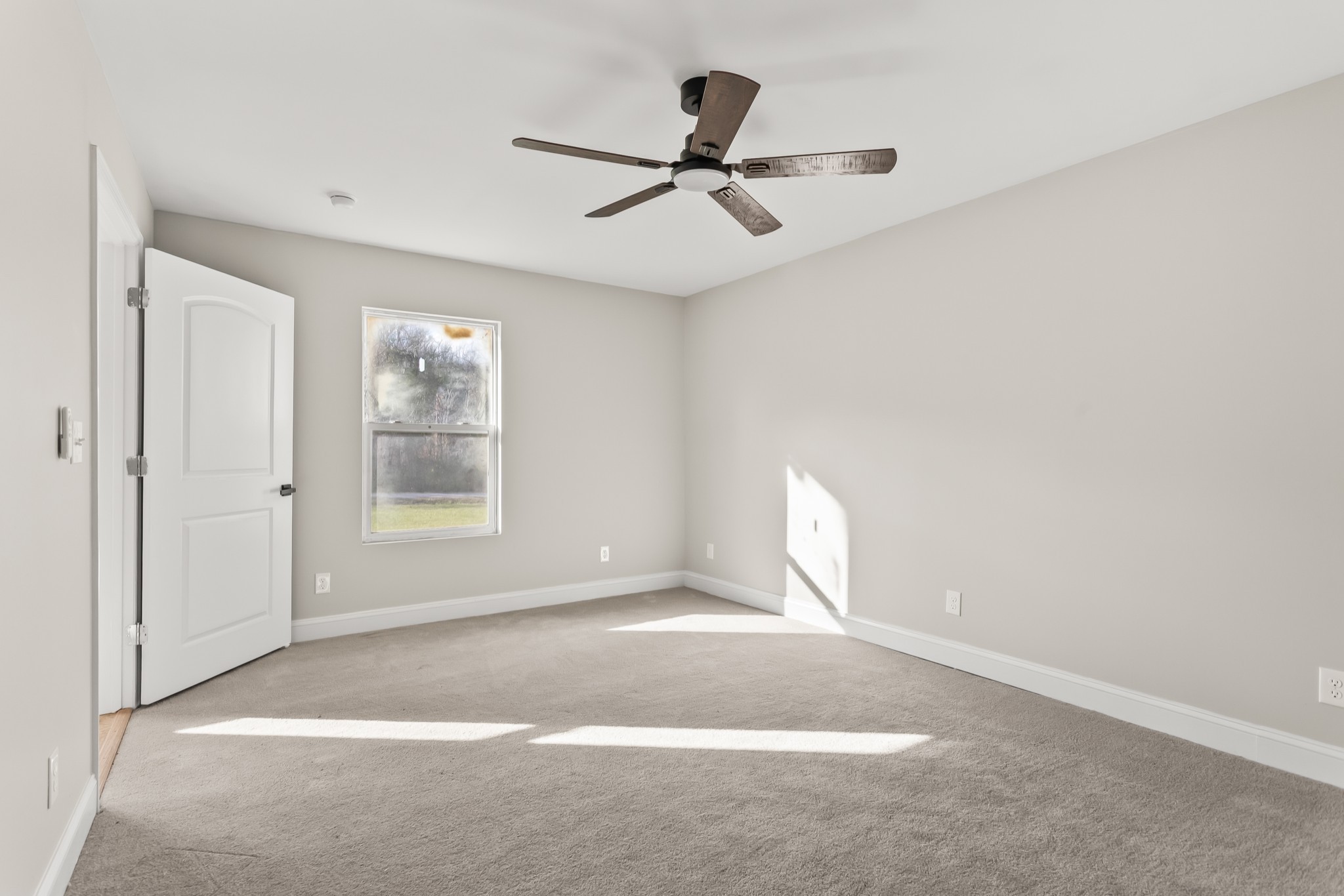 8637 Dog Branch Road Mount Pleasant, TN 38474 - Photo 13 of 41 a view of a livingroom with a ceiling fan and window