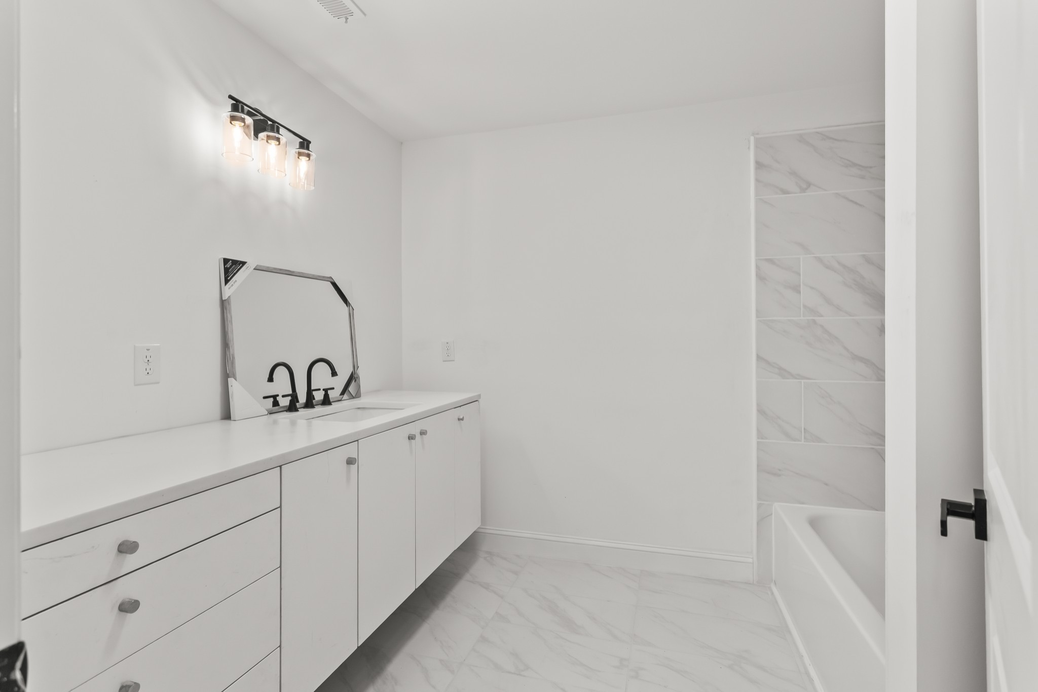 8637 Dog Branch Road Mount Pleasant, TN 38474 - Photo 28 of 41 a bathroom with a sink and mirror