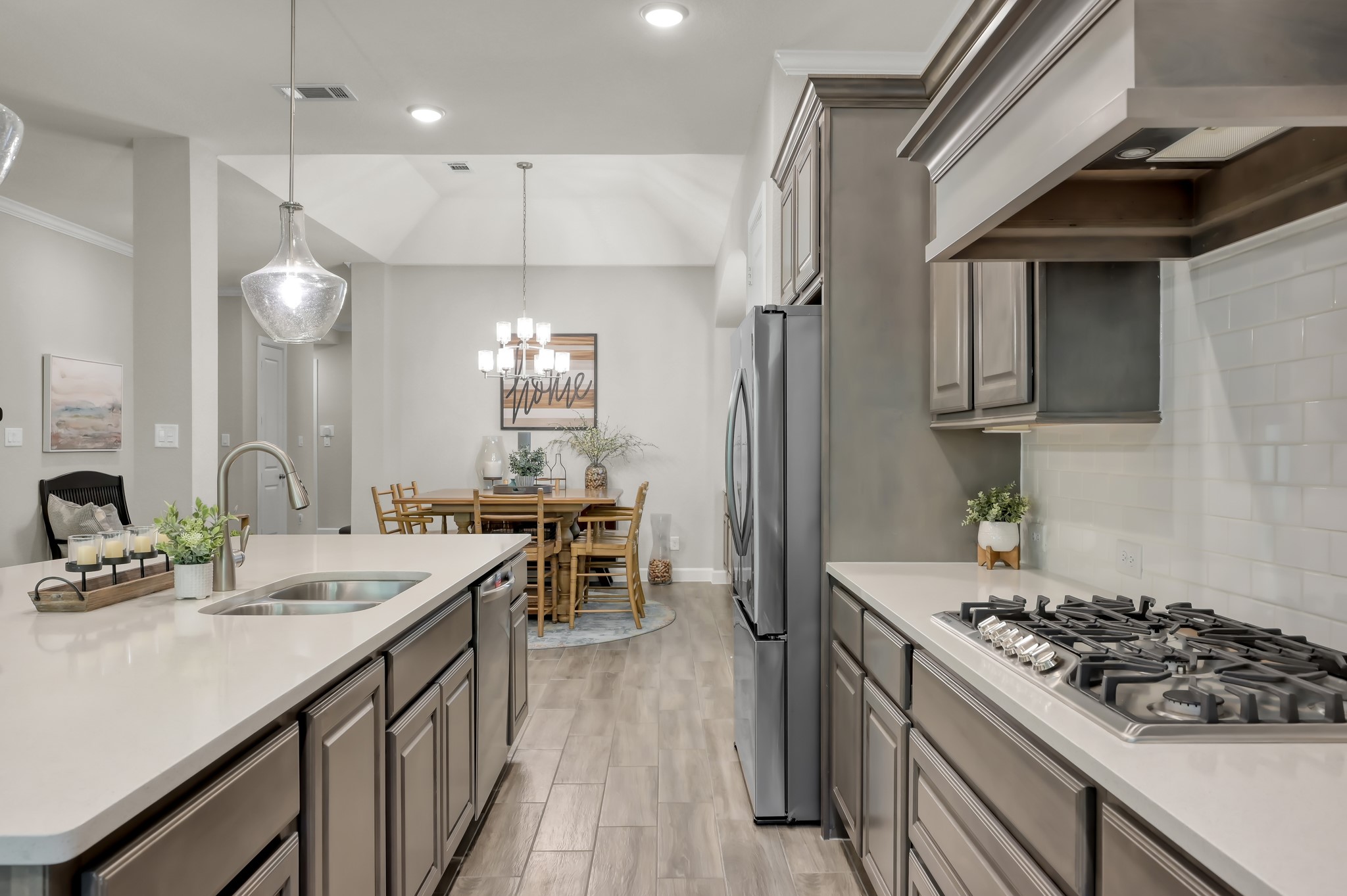 334 Torrey Bloom Loop Conroe, TX 77304 - Photo 18 of 47 Kitchen features gas cooktop and spacious island with sink.