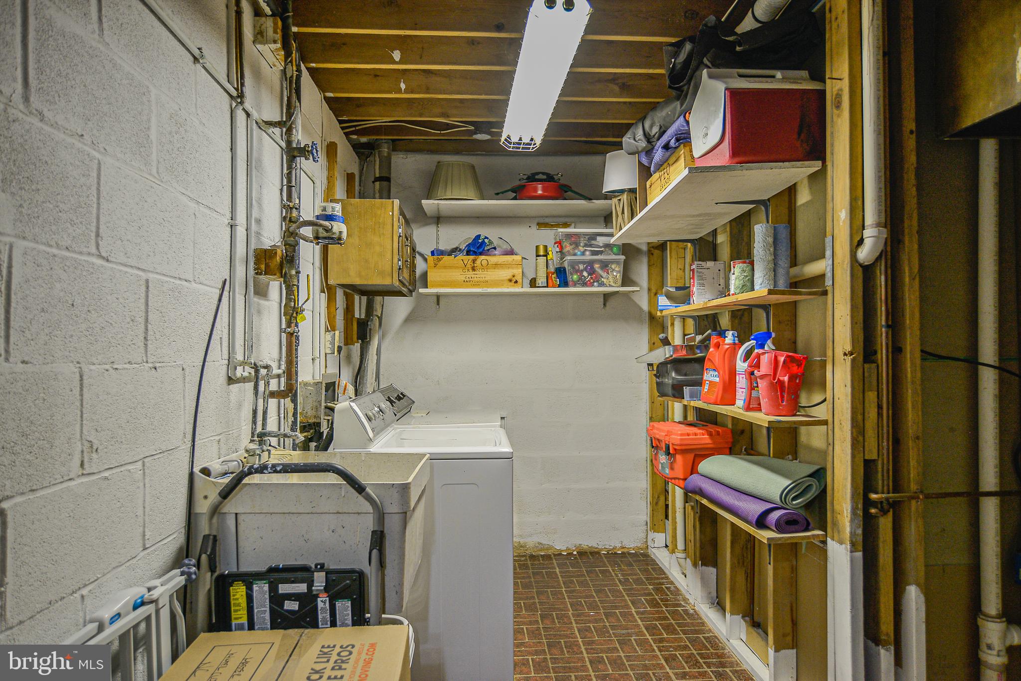 2410 Cloudcroft Square Reston, VA 20191 - Photo 17 of 26 Laundry Area with Storage Shelving & Utility Sink