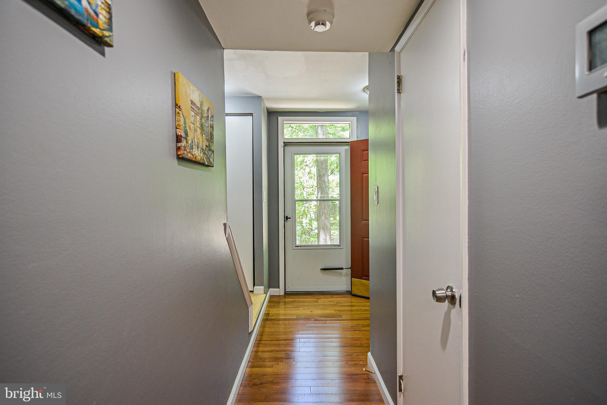 2410 Cloudcroft Square Reston, VA 20191 - Photo 4 of 26 Foyer with Hardwood Floors & Screen Door