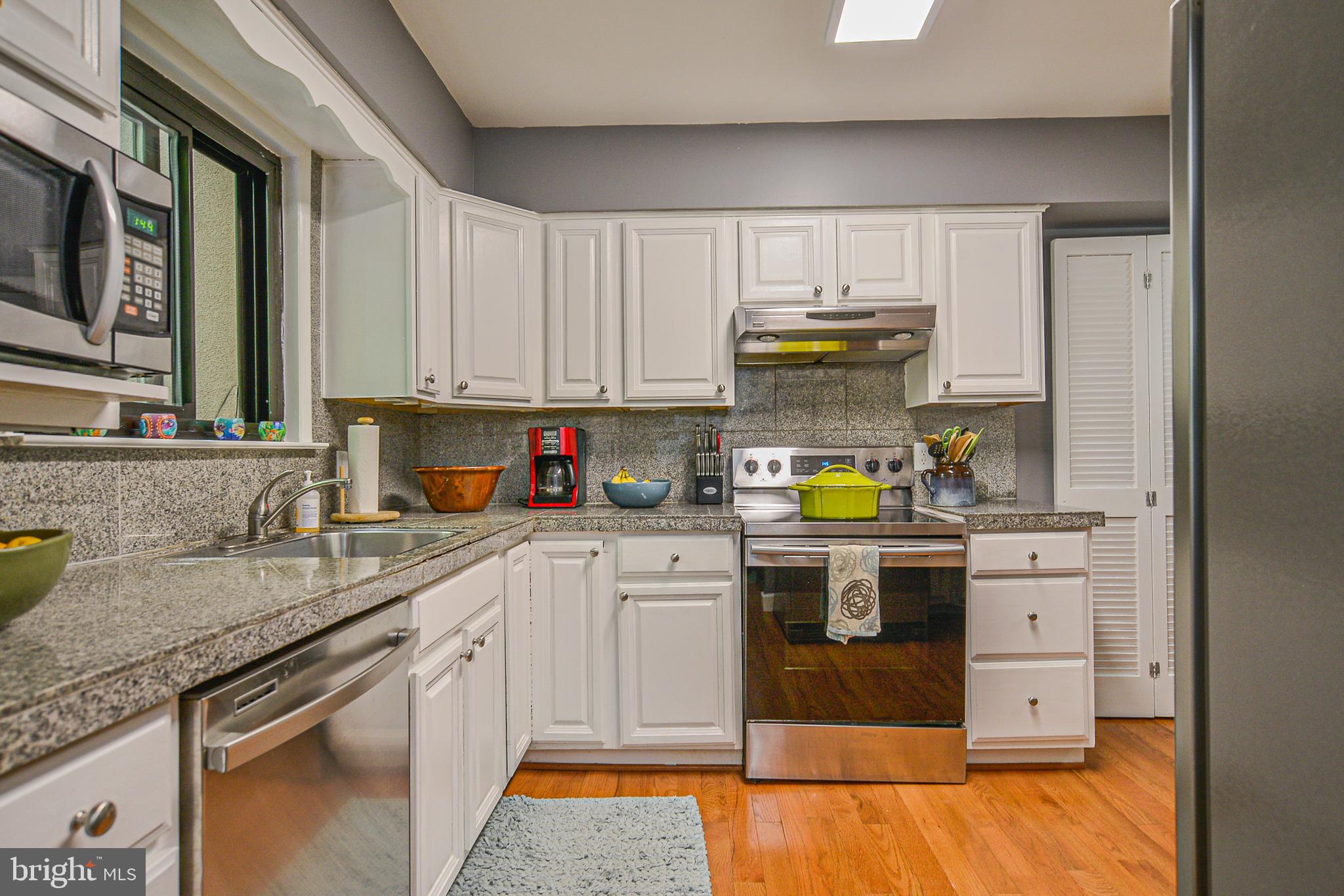 2410 Cloudcroft Square Reston, VA 20191 - Photo 9 of 26 Updated Kitchen w/ White Cabinetry