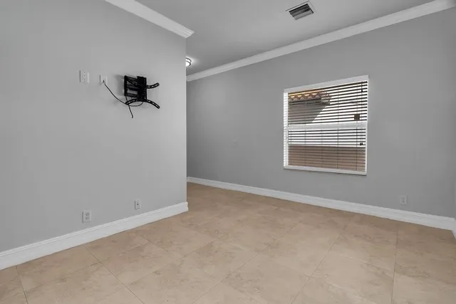 a view of an empty room with a window