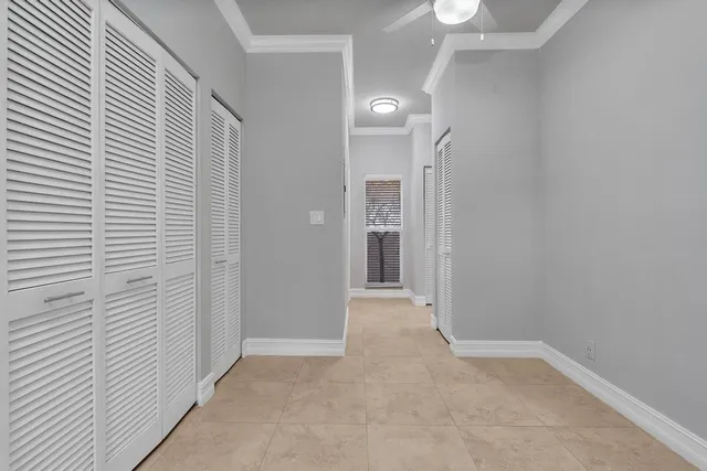 an entryway of a house with a balcony