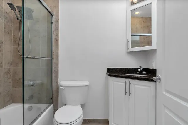 a view of a house with backyard and a garage