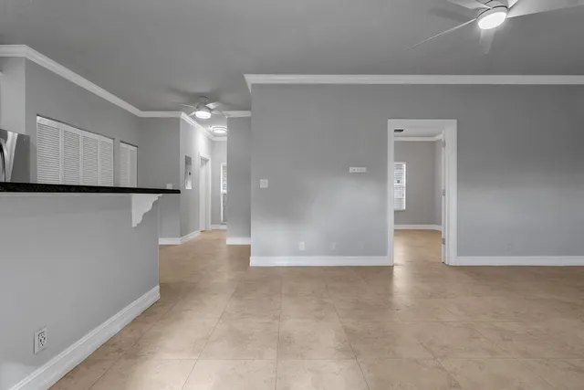 a view of a kitchen with a refrigerator and a cabinets