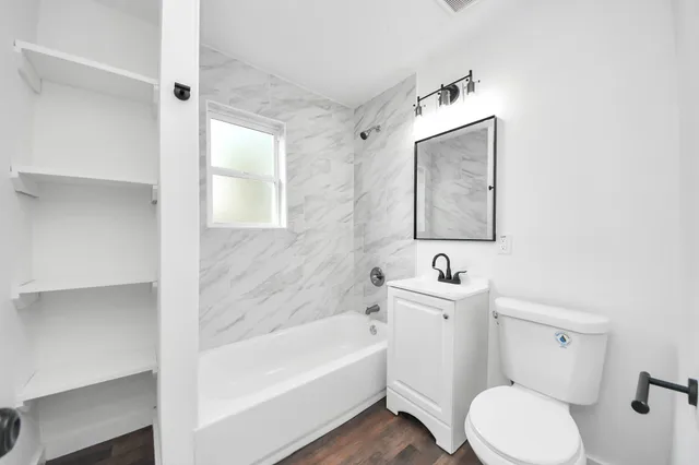 a bathroom with a toilet sink and bathtub